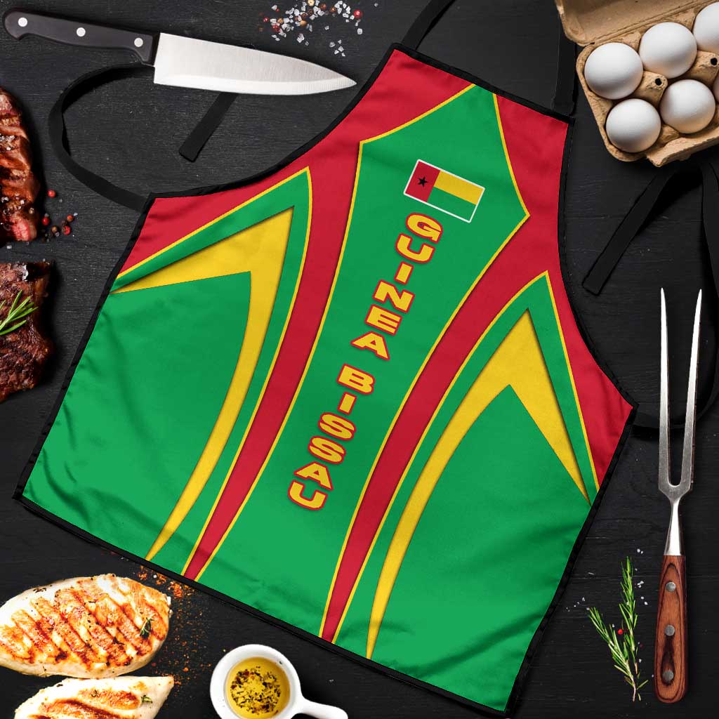 Green apron close-up with vertical Guinea Bissau lettering and red/yellow stripes