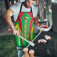 Green apron on chef with Guinea Bissau text and red/yellow stripe design