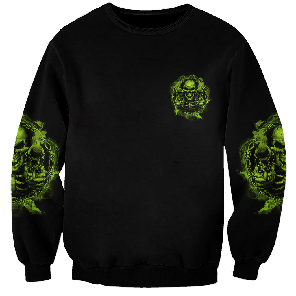 Unisex black sweatshirt with small neon green skull chest print and sleeve graphics