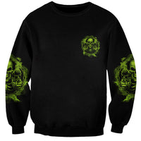 Unisex black sweatshirt with small neon green skull chest print and sleeve graphics