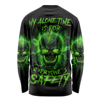 Black long-sleeve shirt with green skull graphic and warning text on the back