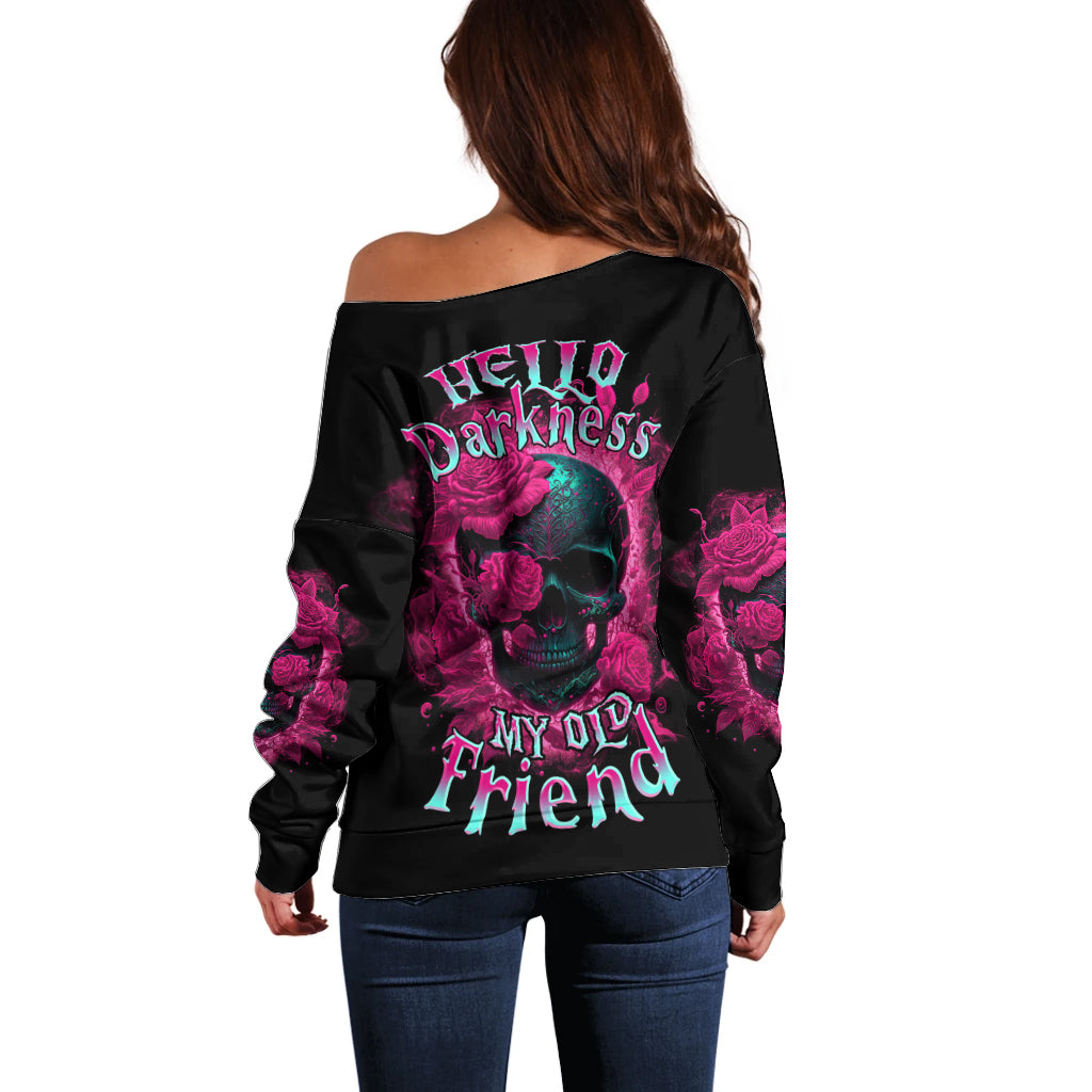 Off-shoulder black sweatshirt with large purple skull-and-rose graphic on back.