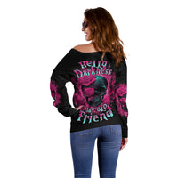 Off-shoulder black sweatshirt with full back “Hello Darkness” skull-and-rose design.