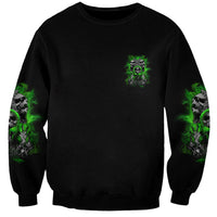 Black unisex sweatshirt with small green skull graphic on chest