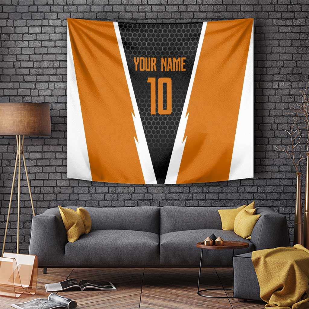 Orange and black sports-style tapestry with white stripes, hex pattern center, 'YOUR NAME' and 10