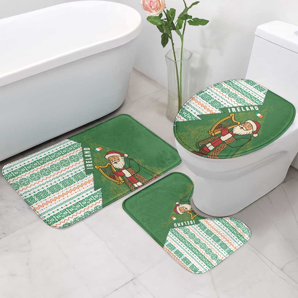 Green holiday bathroom mat set with Santa artwork for toilet lid and floor