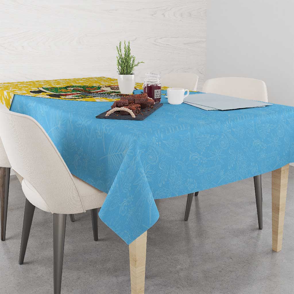 Blue Christmas tablecloth with faint leaf pattern on dining table, corner fold