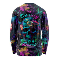 Unisex long-sleeve shirt with neon floral skull graphic and 'Beauty is a Beast' text