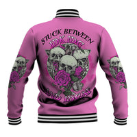 Pink baseball jacket with skull-and-rose back graphic, striped collar and cuffs