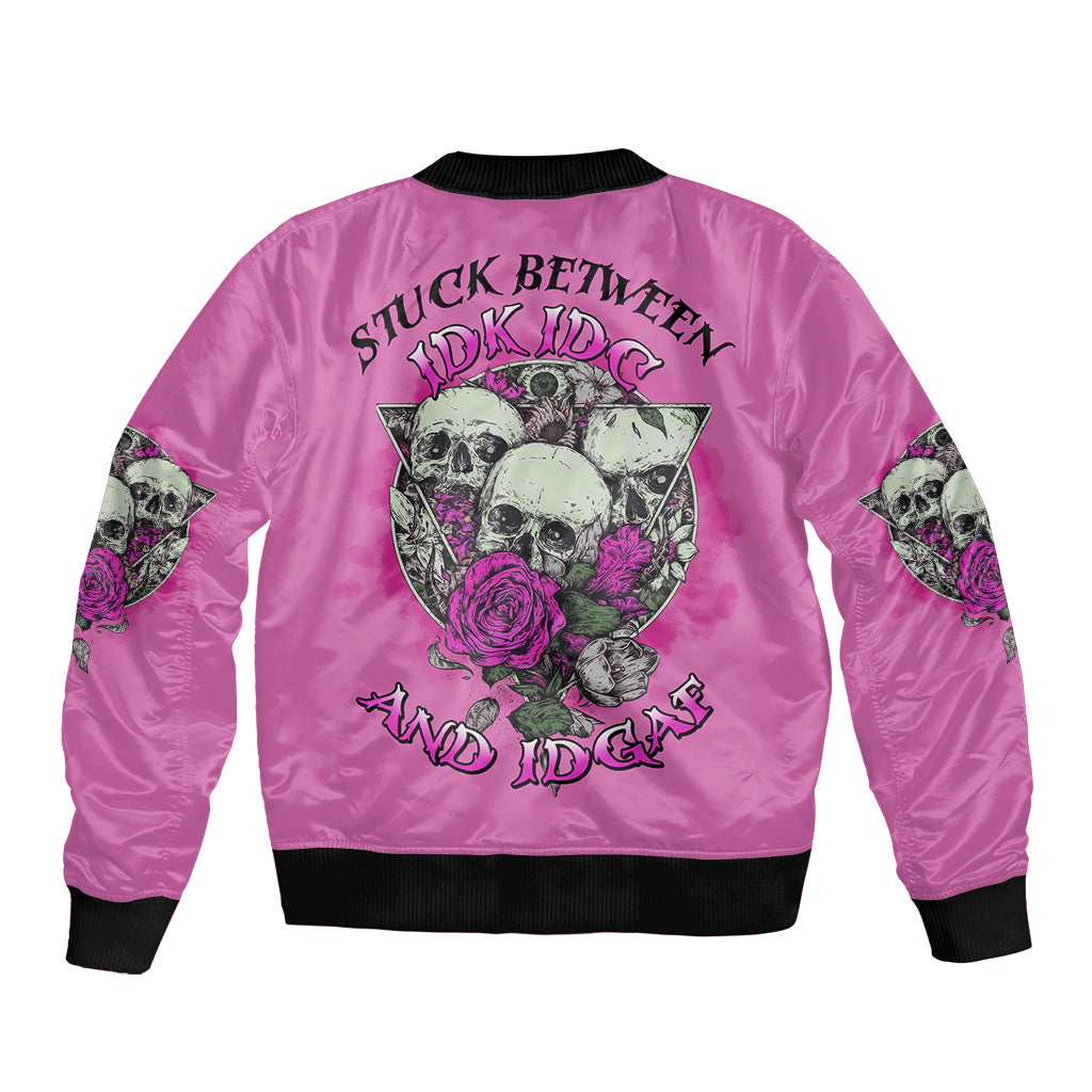 Pink bomber jacket with skull rose graphic on back and black ribbed cuffs