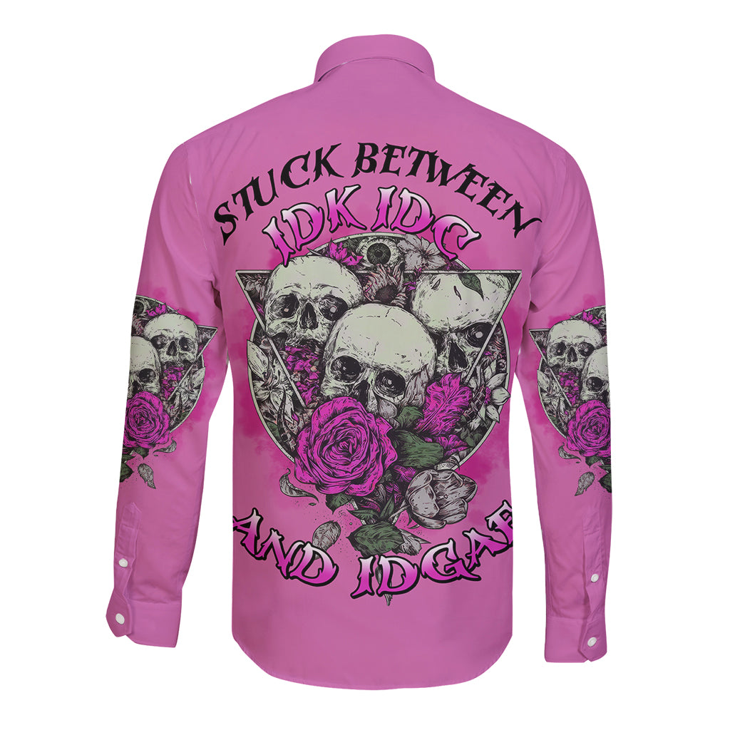 Pink long-sleeve button shirt with back skull-and-rose graphic and dark lettering