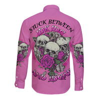 Pink long-sleeve button shirt with back skull-and-rose graphic and dark lettering