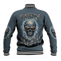 Dark teal baseball jacket with striped collar; large back skull and lightning graphic