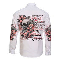 White long-sleeve button shirt, back graphic of skull, roses, and quote text
