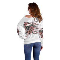 Off-shoulder white sweater with back skull and rose slogan graphic