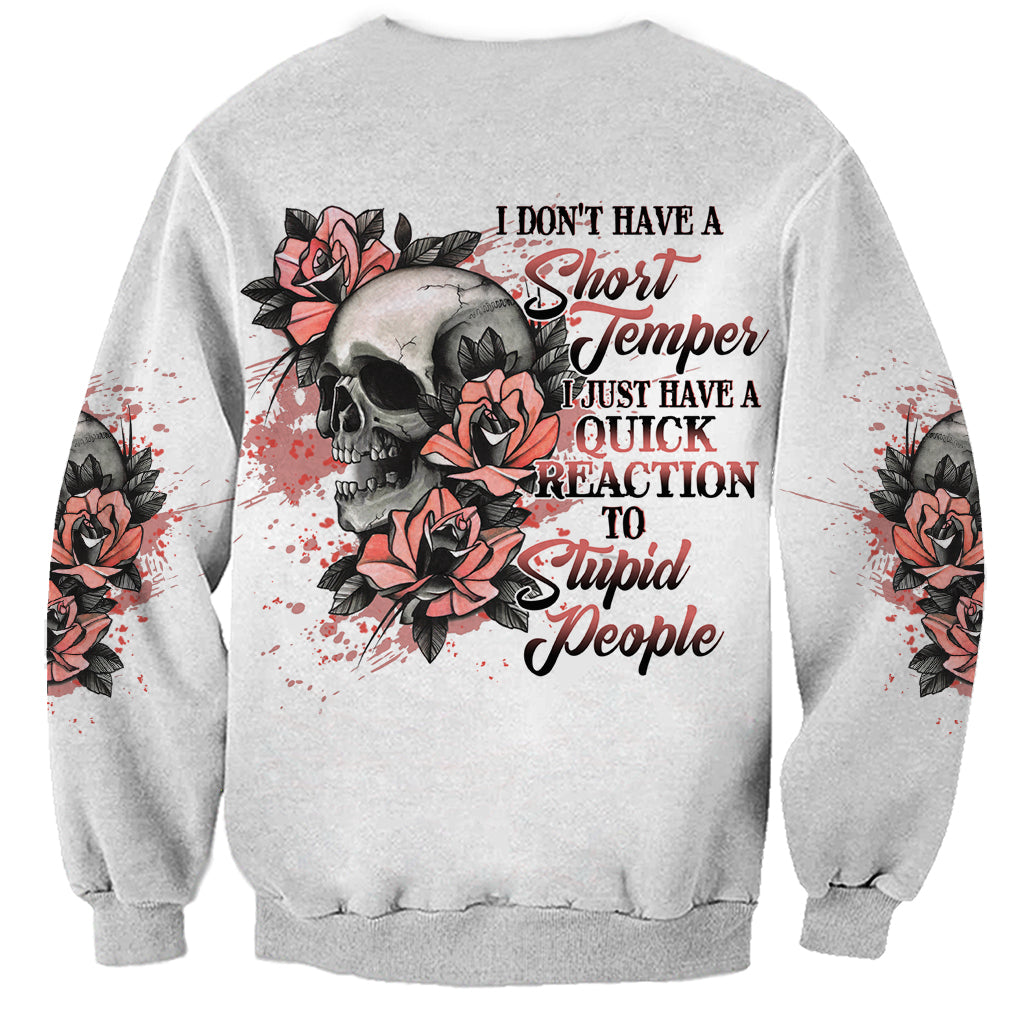 Gray sweatshirt with skull and red rose graphic plus rebellious text on back