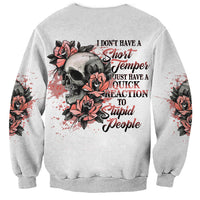 Gray sweatshirt with skull and red rose graphic plus rebellious text on back