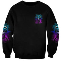 Unisex black crewneck sweatshirt with small center skull print and sleeve graphics