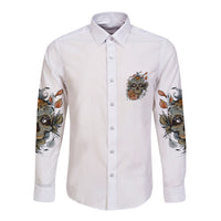 White long-sleeve button shirt with front animal skull emblem and floral sleeve artwork
