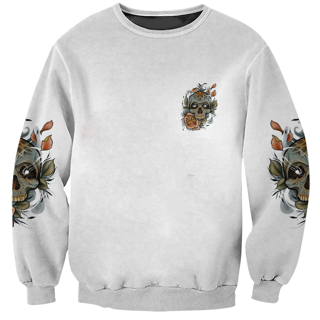 Gray unisex crewneck sweatshirt with small skull graphic on chest and rose sleeve prints