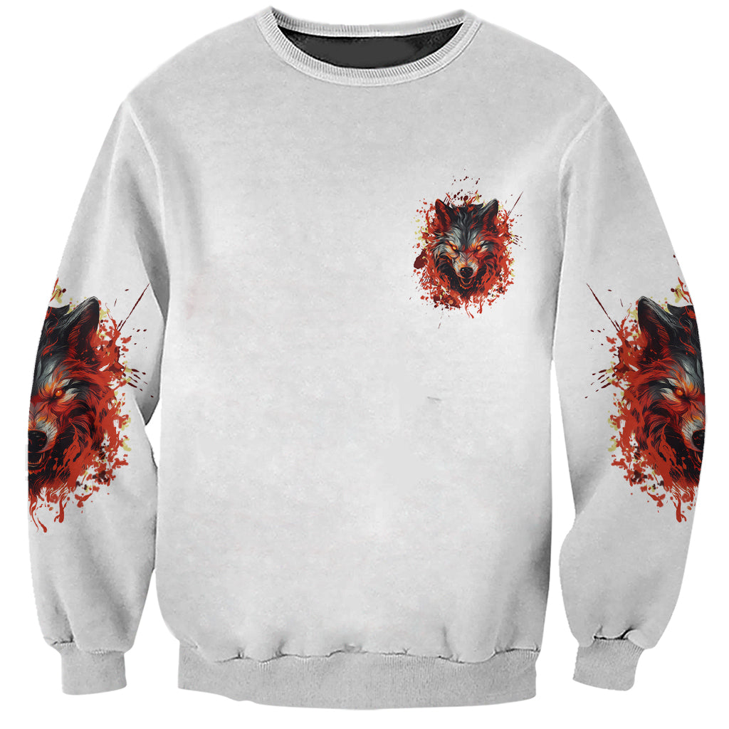 Gray unisex sweatshirt with small red wolf head splatter front and matching sleeve prints