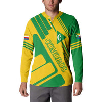 Green and yellow button-up sweatshirt with diagonal stripes and Comoros emblem