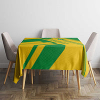 Comoros flag tablecloth folded over table with green and yellow diagonal pattern