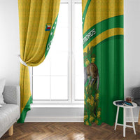 Window curtain pair in yellow and green with Comoros flag graphic and lemur motif