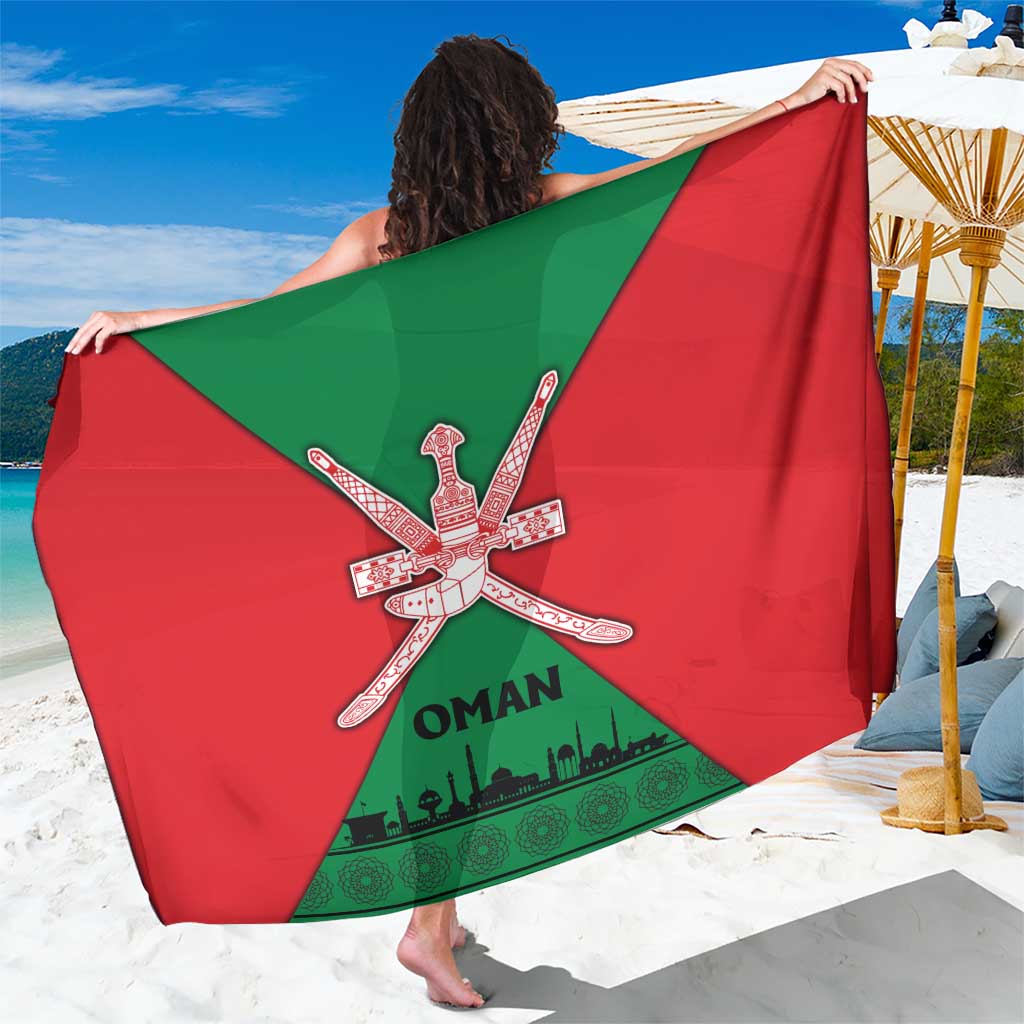 Oman flag sarong in red and green with crossed khanjar emblem and text