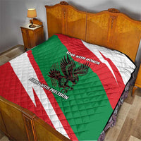 Oman quilt with red/green/white diagonal stripes, quilted fabric, falcon graphic and text