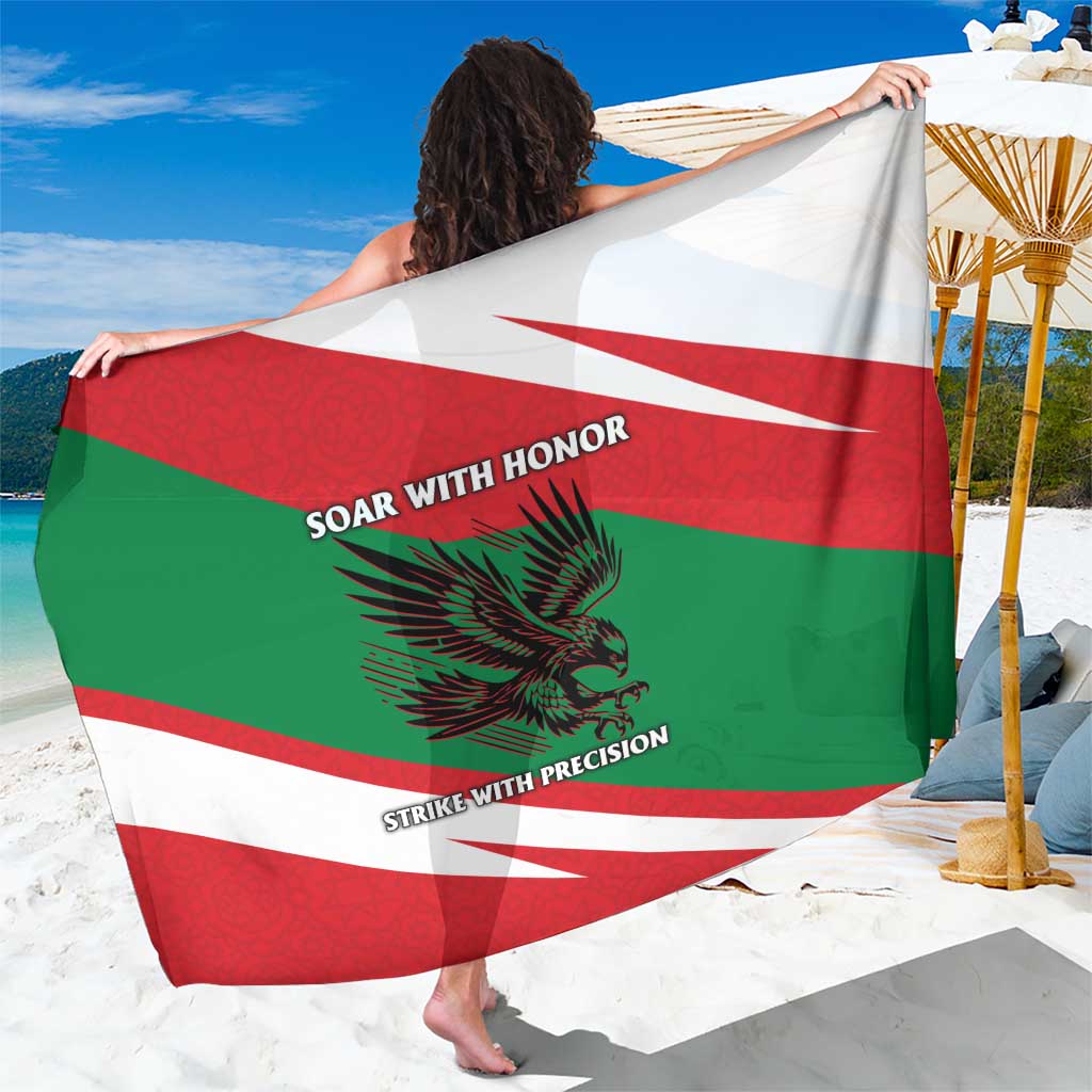 Oman flag sarong with red, green, and white diagonal stripes, falcon graphic and motto text