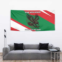 Oman flag tapestry hanging above sofa, showing falcon design and diagonal stripes