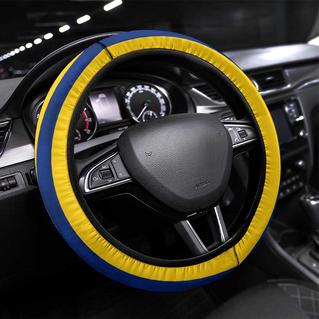 Blue and yellow steering wheel cover with stitched edge and national crest design