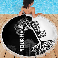 Round beach blanket with black circle, white tree roots and vertical name text