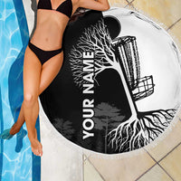 Round beach blanket with black-and-white tree roots graphic and fringe edge
