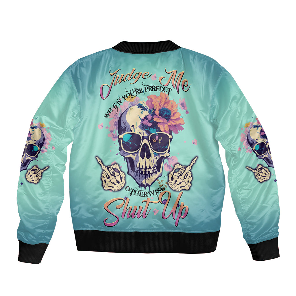 Light teal bomber jacket, ribbed cuffs, skull graphic with 'Shut Up' on back