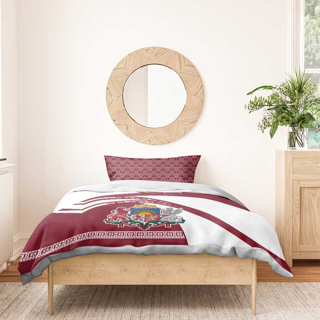 Red and white duvet and pillow set with Latvia crest, flag stripes, on wooden bed frame