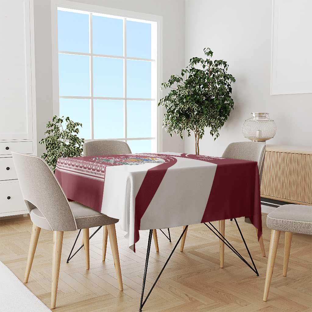 Red and white Latvia tablecloth with diagonal panels and traditional folk border patterns