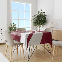 Red and white Latvia tablecloth with diagonal panels and traditional folk border patterns