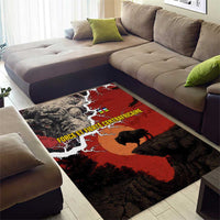 Red and black area rug with buffalo silhouette and nature-style pattern