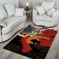 Area rug in red and black with buffalo silhouette and map-like design