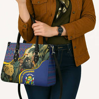 Multicolor leather tote bag with jungle scene print and emblem badge, front view
