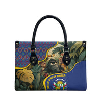 Multicolor leather tote with jungle animal graphic, top handles and side studs