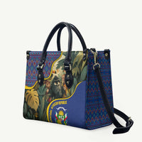 Multicolor leather tote bag with jungle print, crossbody strap and emblem badge