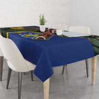 Rectangular blue tablecloth with jungle animal panel and yellow stripe edge detail.