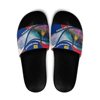 Black slide sandals with multicolor mountain graphic strap and crown emblem
