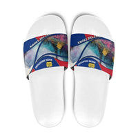 White slide sandals with multicolor mountain graphic strap and crown emblem