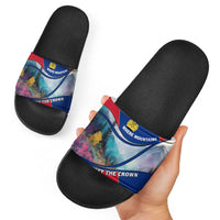 Black slide sandals with multicolor mountain graphic band and crown emblem, side view
