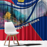 Red and blue window curtain with mountain artwork, crown emblem, and arched text detail.