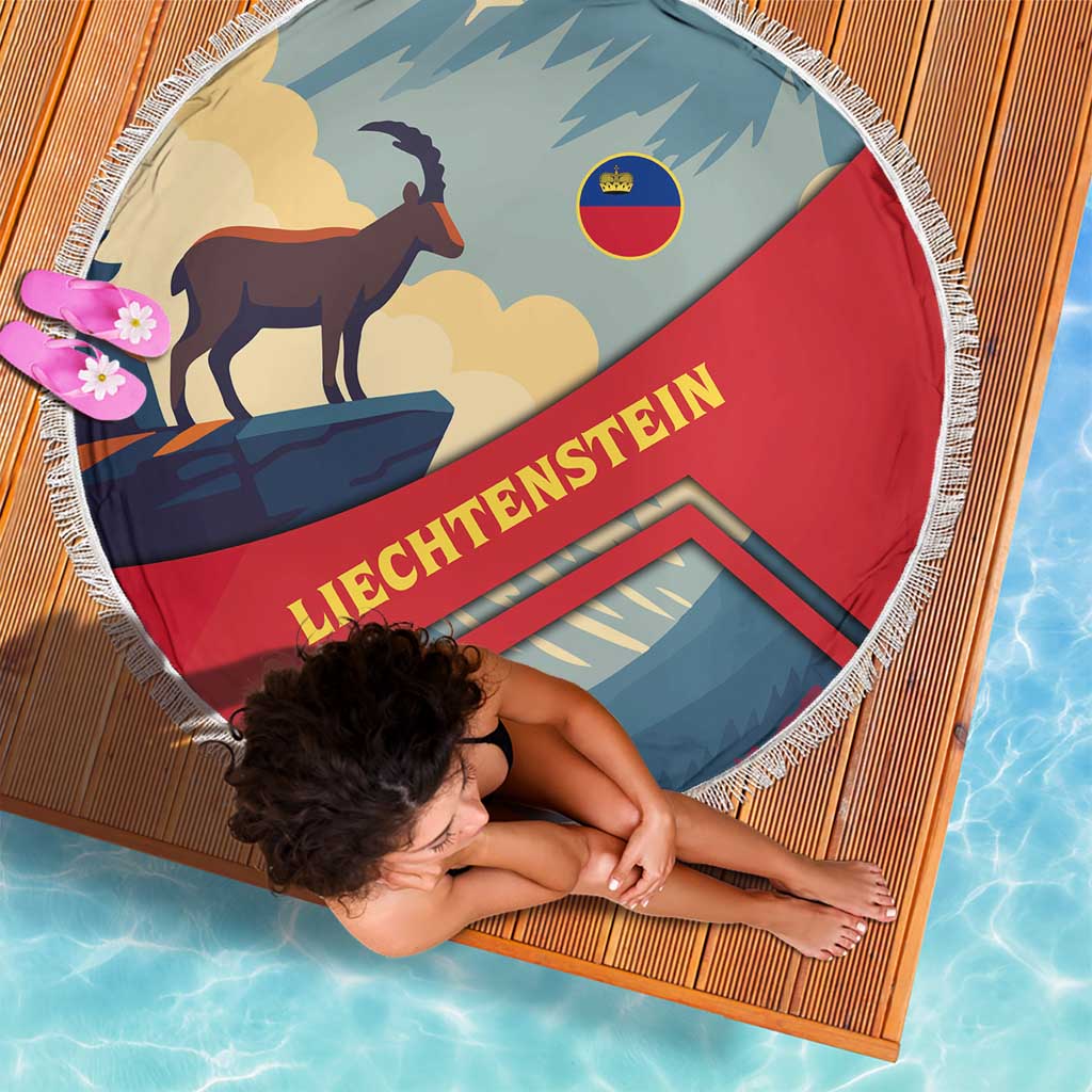 Round fringe beach blanket showing goat over mountains with red blue banner and text